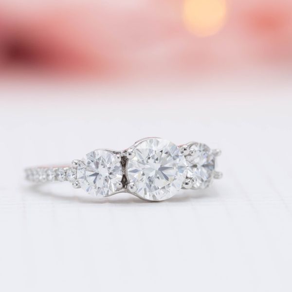 The lab-made diamonds in this three-stone setting have all the durability and beauty of a natural diamond.