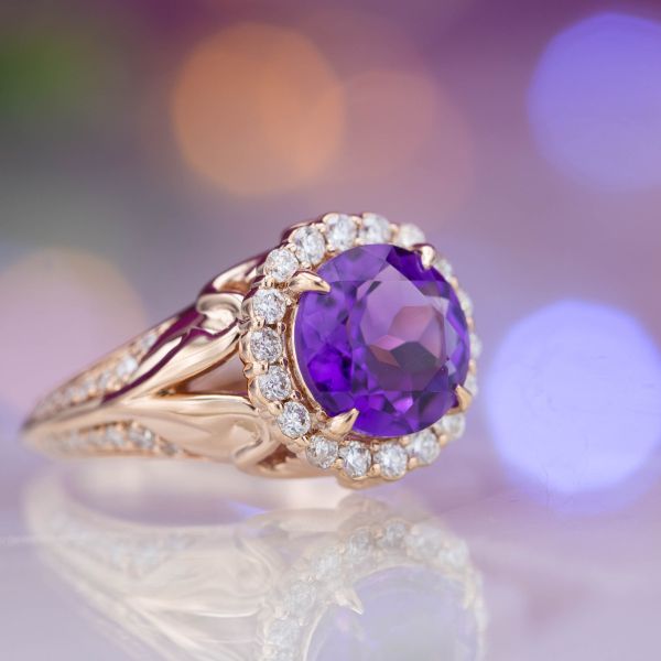 A scalloped halo gives this amethyst engagement ring a vintage feel.