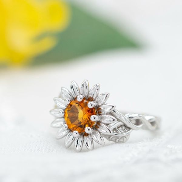 Citrine sunflower engagement ring with vining band, sculptural leaf and petal setting.