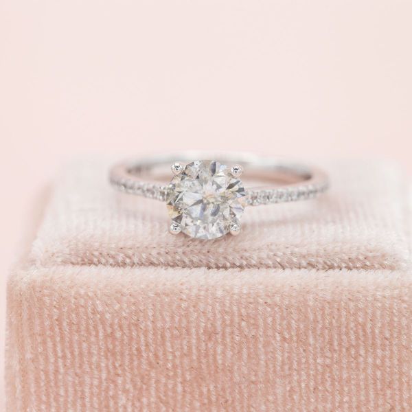 The salt and pepper diamond at the center of this engagement ring is very translucent with only a few light inclusions.
