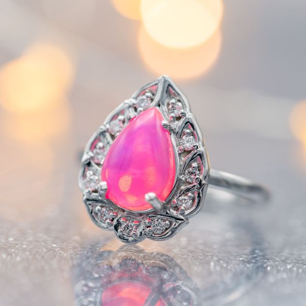 This engagement ring's luminescent, bubblegum pink opal makes a beautiful, unusual statement.