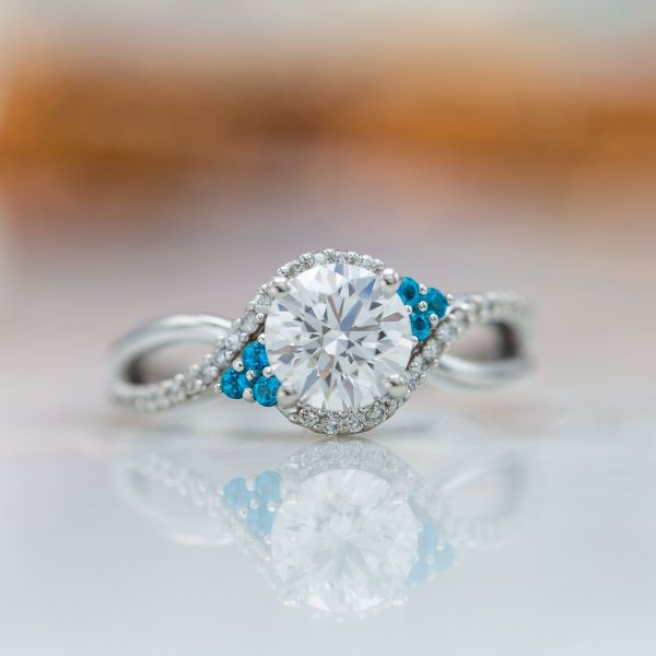This diamond ring packs a whole ton of sparkle and adds a bit of color with topaz accents.