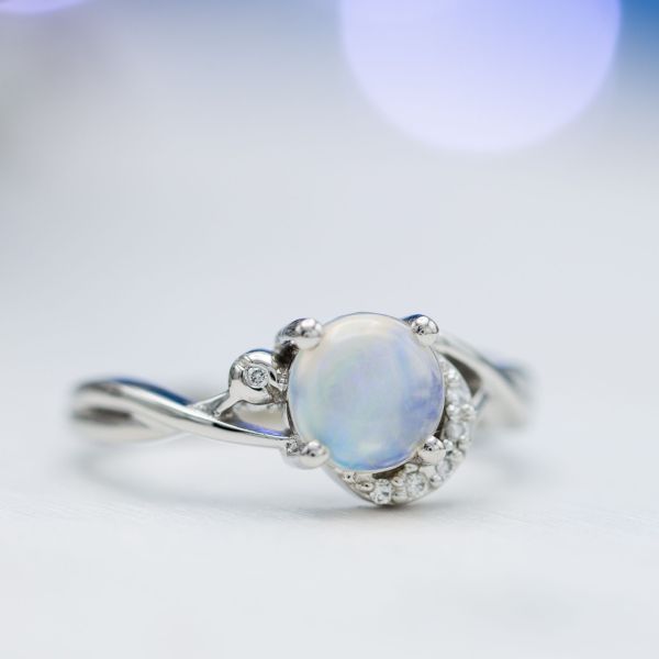 This semi-translucent opal shows a pale blue hue reminiscent of a moonstone.