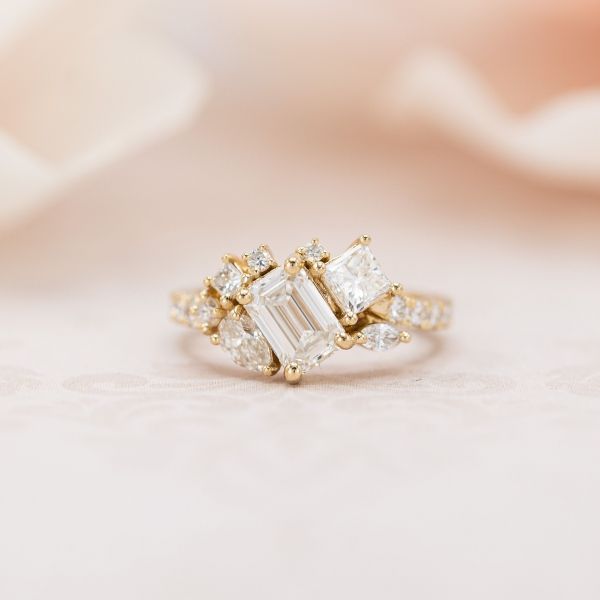 An array of different cut lab diamonds makes up this pretty cluster engagement ring.
