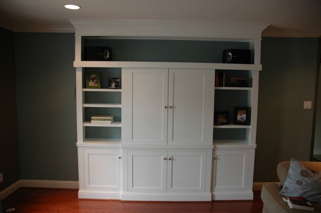 Hand Made Custom Entertainment Center With Sliding Doors by Custom