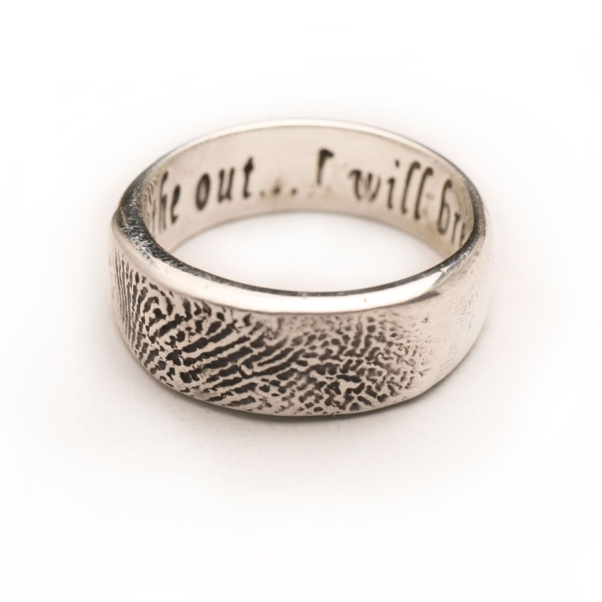 Man s wedding ring with fingerprint