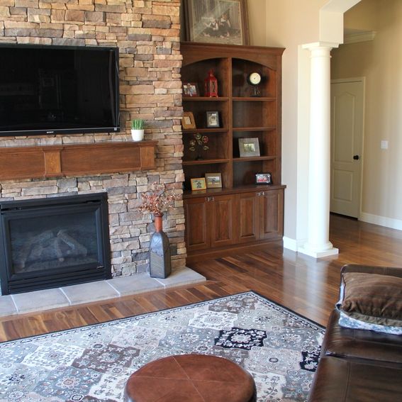 Hand Crafted BuiltIn Bookcases And Fireplace Mantle by Intelligent