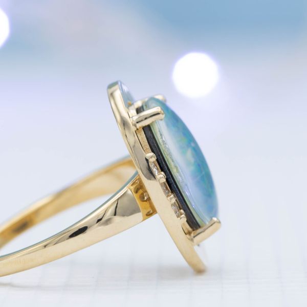 Viewed from the side, the layers of this assembled doublet opal become visible.
