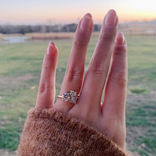 Our customer, Kacie, showing off the ring we designed with her around her mother's heirloom diamonds.