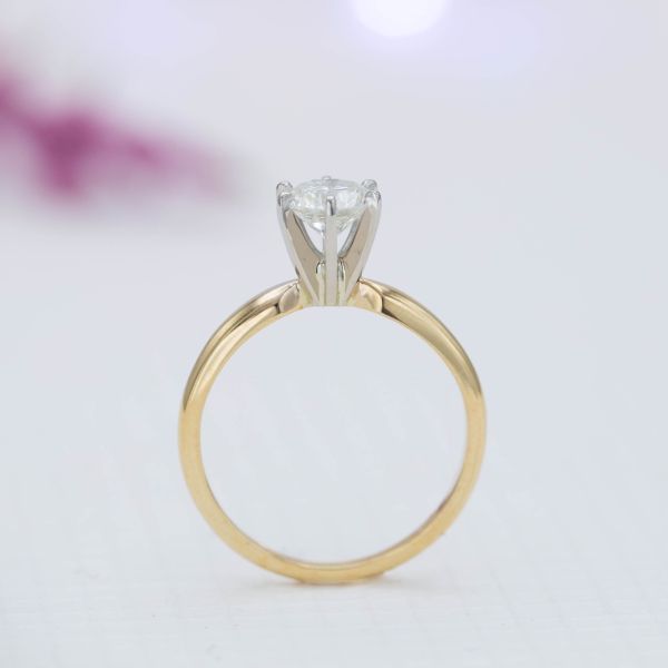 The high, fluted prong setting for this diamond ring is reminiscent of a martini glass.