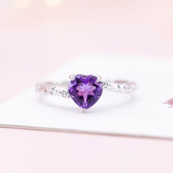 This heart shaped amethyst is the epitome of romance with its vibrant purple hue and white gold band.