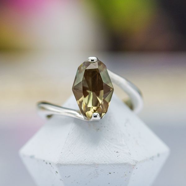 A modern sunstone ring set with a minimal white gold setting showcasing the unique center stone.