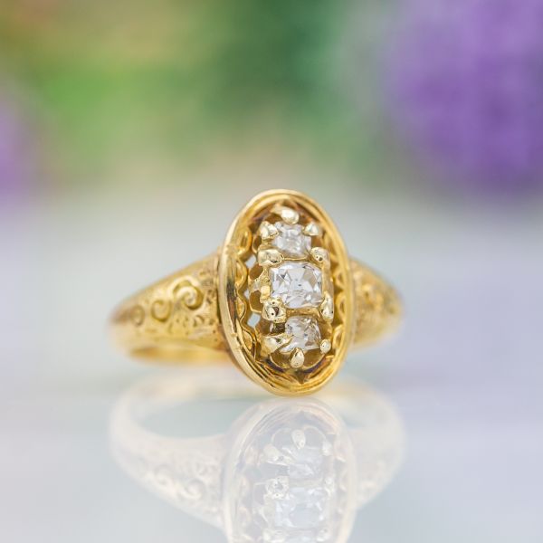 A beautiful antique ring, dating to the late 1800s. The diamonds in this ring appear to be original Old Mine cuts typical of that era.