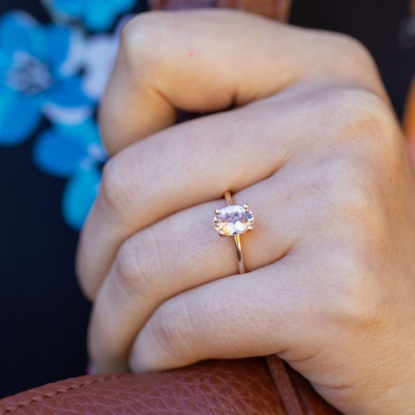 A classic, minimal solitaire morganite engagement ring is a showcase for the center stone.