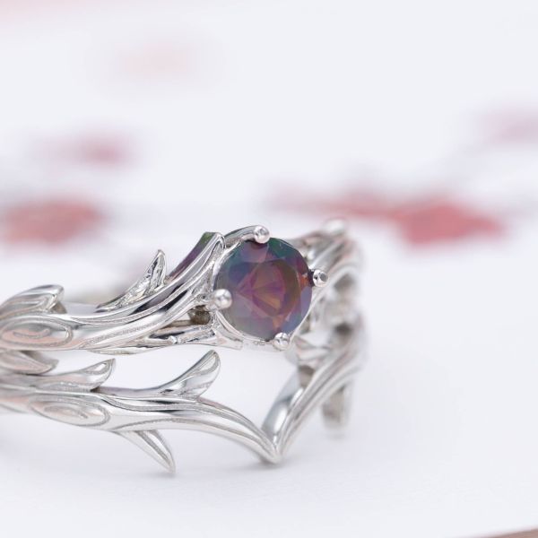 A faceted, dusky purple opal lends its unique color to this nature-inspired bridal set.