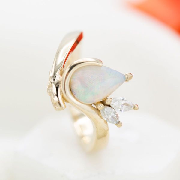 Ocean life inspired this opal and yellow gold engagement ring.
