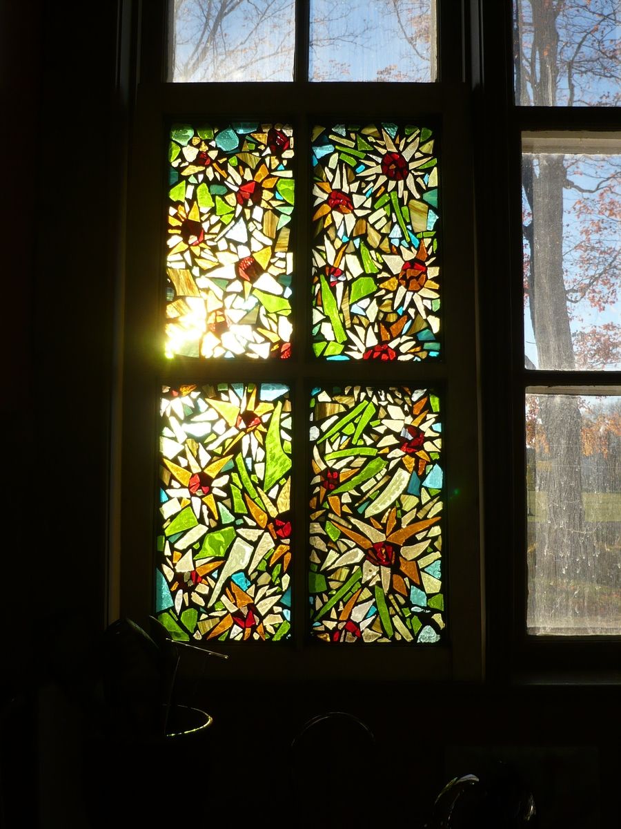 how does one attach a stained glass design to a window