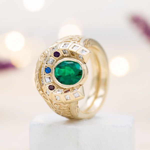 This Marvel inspired ring holds a mesmerizing green emerald, crafted to resemble Thanos’ gauntlet.