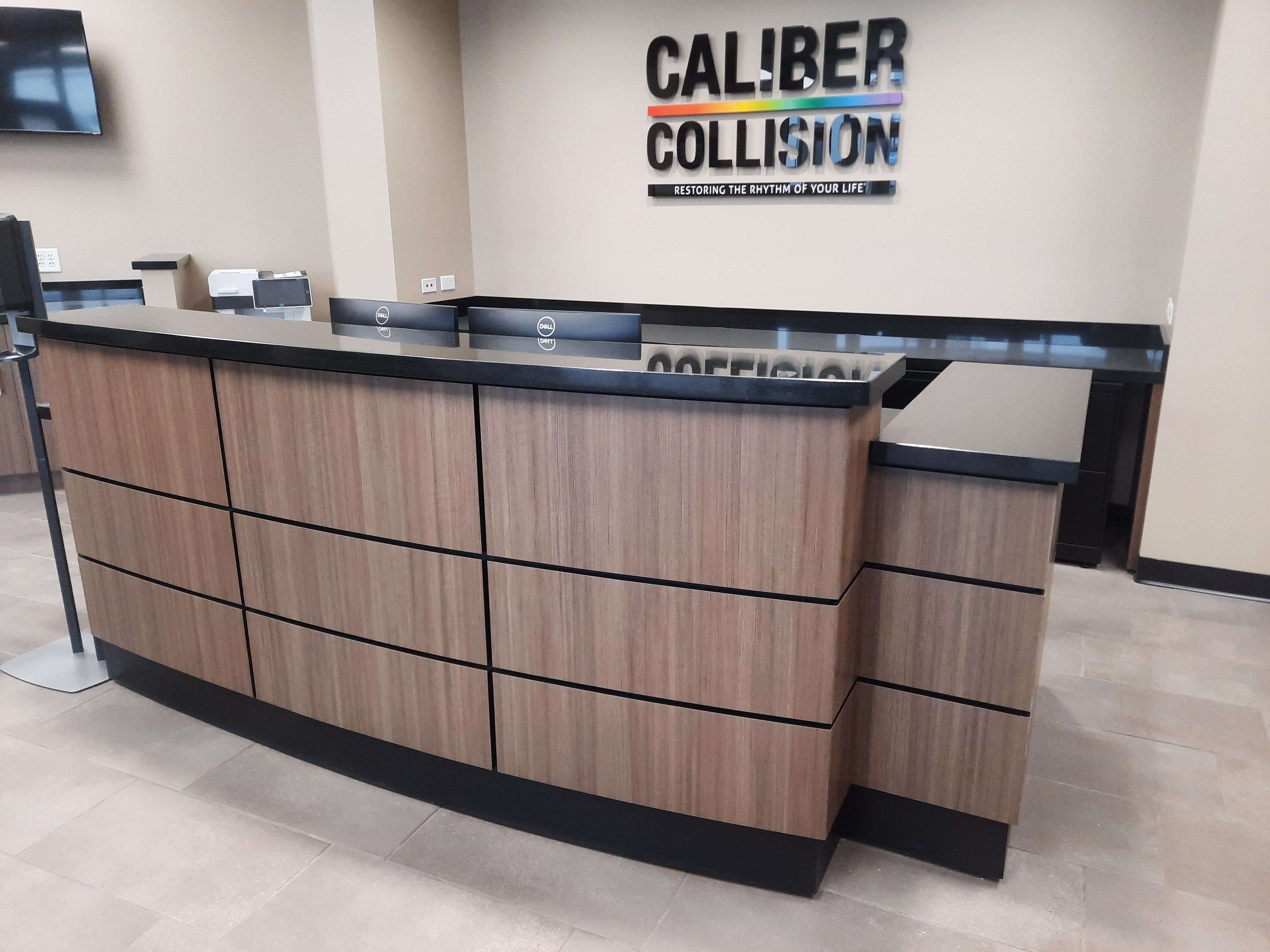 Hand Crafted Custom Wood Grain And Granite Reception Desk by Suburban