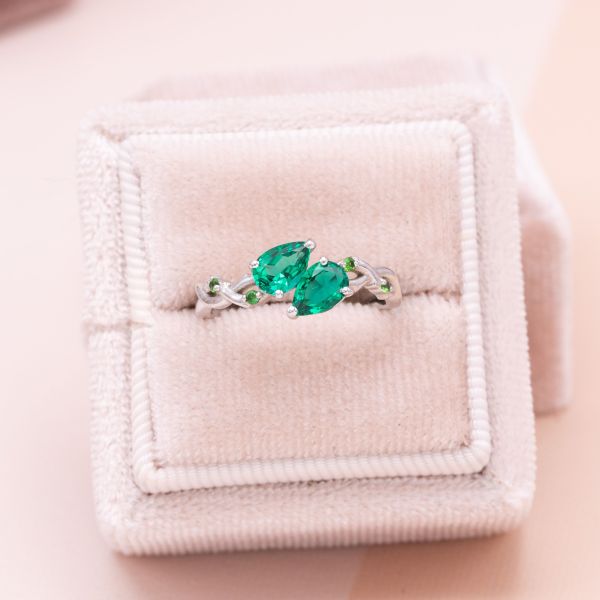 These two emeralds are natural mined, sitting in a toi et moi setting of white gold.