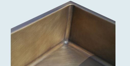 Custom Made Bronze Sink With Apron