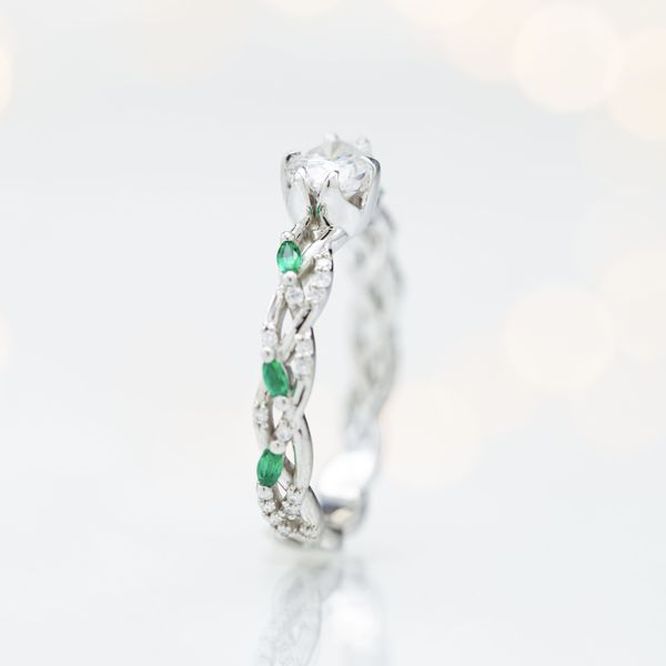 We’re getting green goddess vibes from this nature inspired east-west engagement ring.
