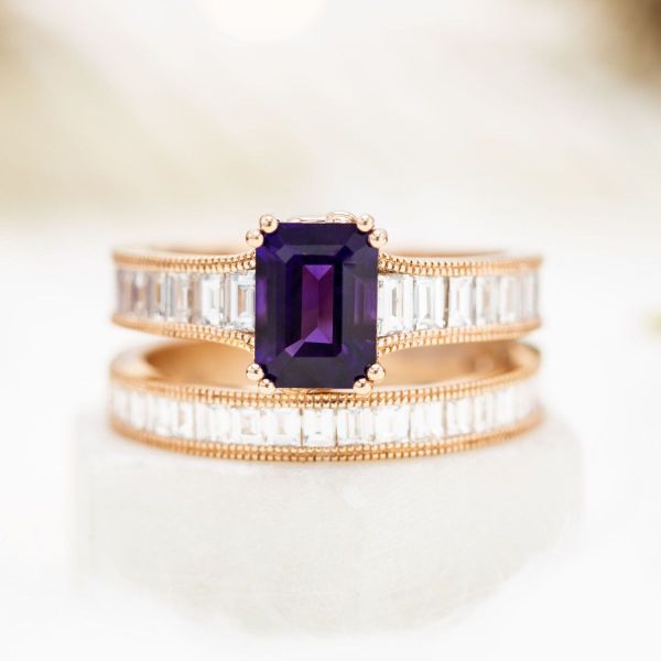 Chanel is the name of the game with this emerald cut amethyst surrounded by chanel set baguette cut diamond accents.