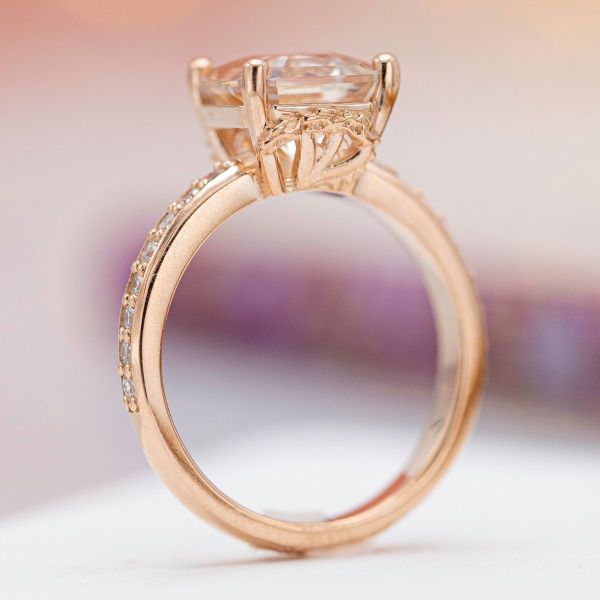 An ornate rose gold Game of Thrones engagement ring hides Targaryen inspired sigils in the ring’s gallery.