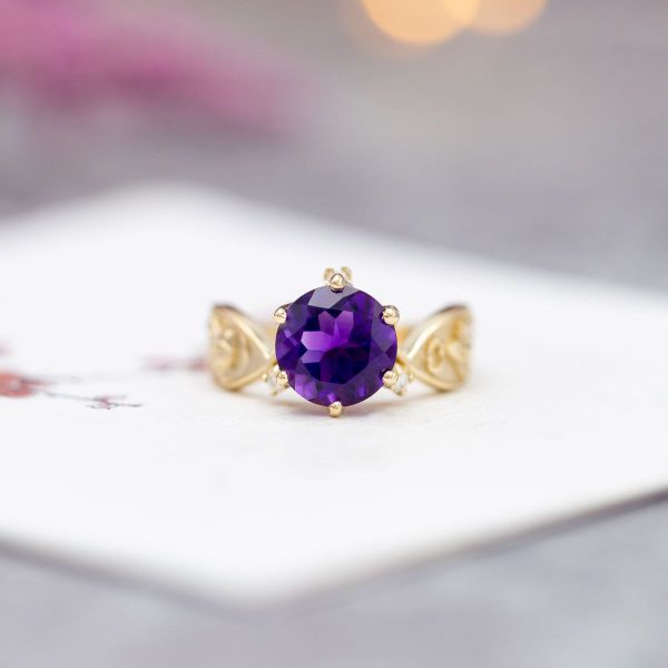 The amethyst in the center of this ring has a very strong saturation.