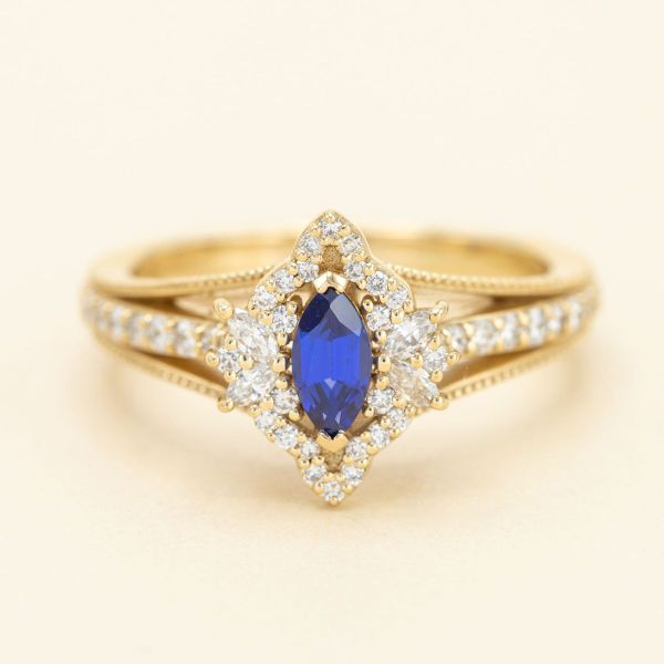This marquise cut sapphire and diamond engagement ring began with a vintage inspiration.