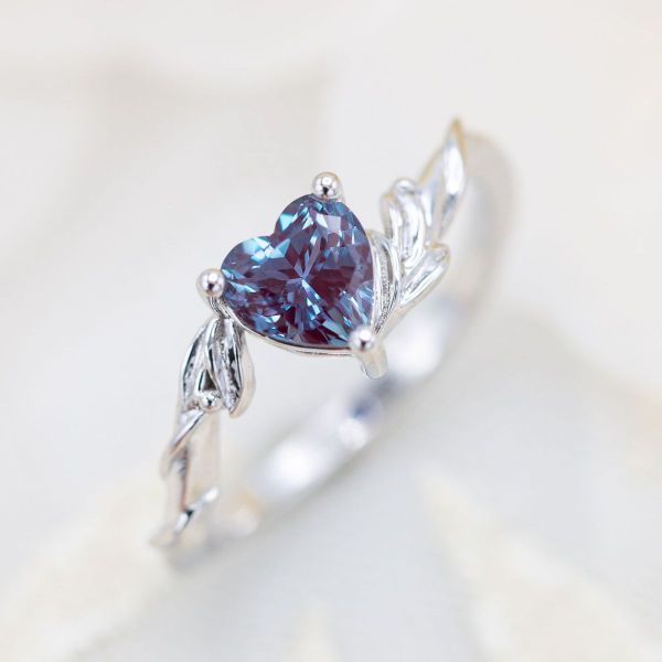 This couple's love truly shines through in this heart shaped alexandrite engagement ring.