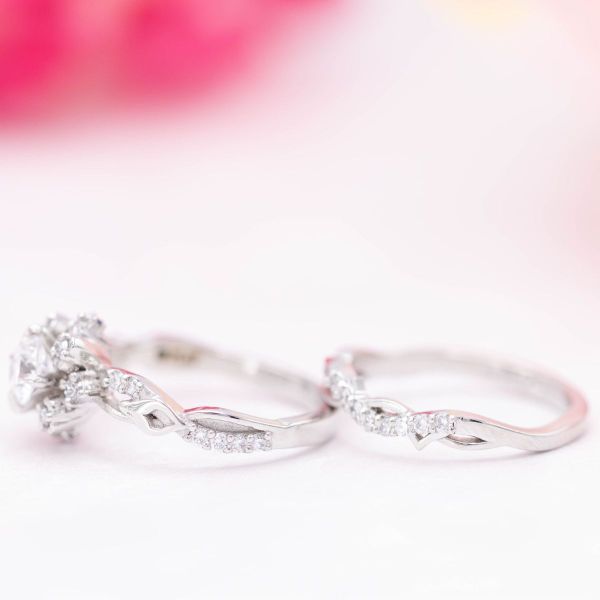A sunburst halo turns this diamond and platinum engagement ring into an everlasting snowflake.