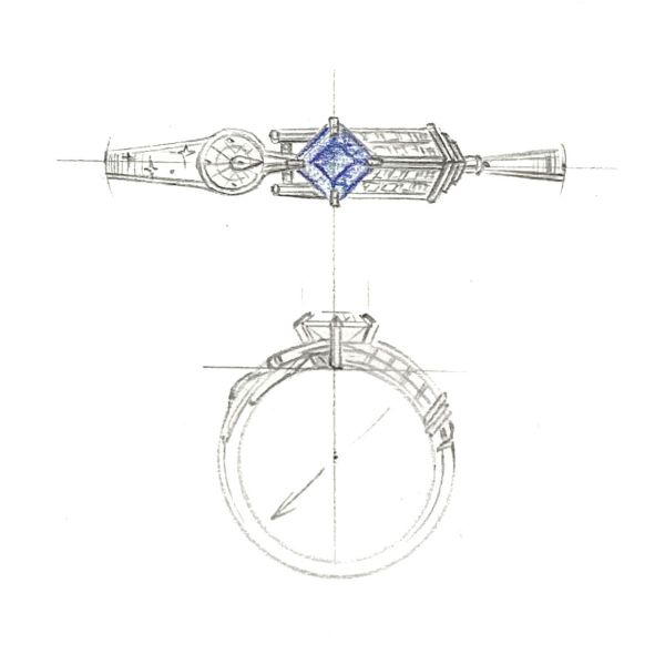 This engagement ring features a blue sapphire center stone and spaceships from Star Trek and Dr. Who