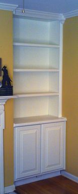 Custom Made Built In Bookcase With Hidden Storage