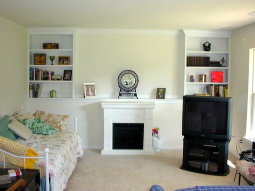 Custom Made Built-In Shelving With Crown Molding Trim