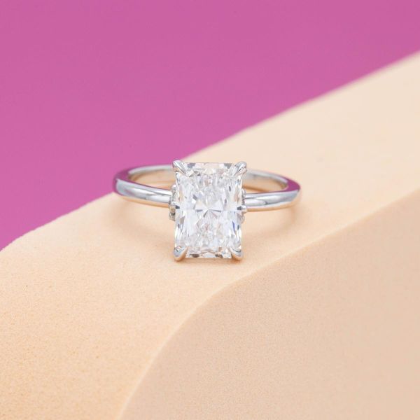 White gold and a lab diamond make up a simple, delicate engagement ring.