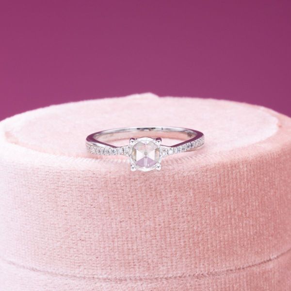 The intimate and inviting nature of the rose cut diamond pairs perfectly with a dainty white gold band in this engagement ring.