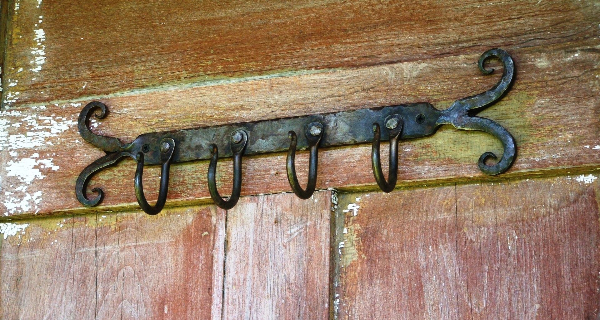 Custom Wrought Iron Wall Rack by Hawley's Fine Woodworking