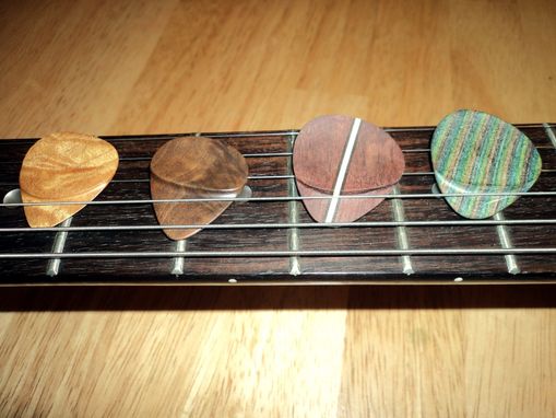 Custom Made Wooden Guitar Picks With Hand-Shaped Thumb Grip