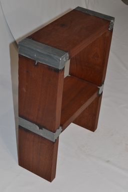 Custom Made Cast-Wood Stools Rendered In Mahogany And Aluminium.