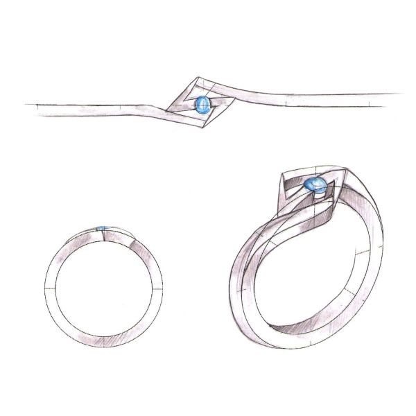 A round sapphire and lightning symbol center this Ms. Marvel inspired engagement ring.