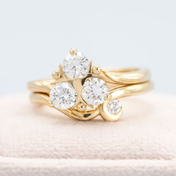 This elegant Zelda inspired engagement ring features yellow gold and diamond accents in the shape of Zora’s Sapphire.