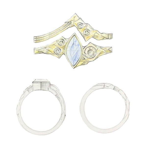 This fantasy-inspired ring boasts a marquise shaped sapphire nestled in a yellow gold bezel with white accent stones and a matching textured wedding band.