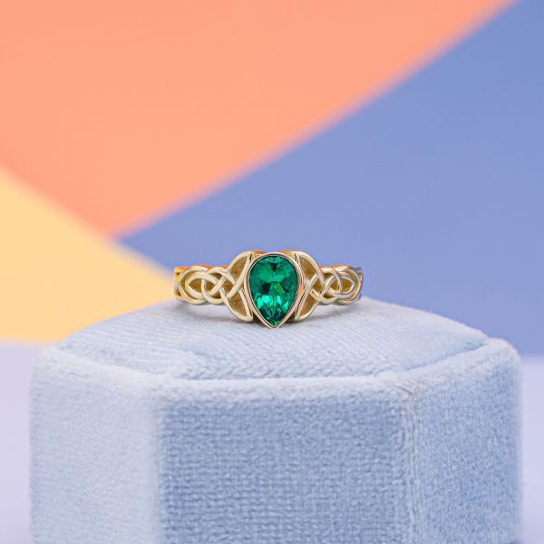This pear shaped emerald is lab created.