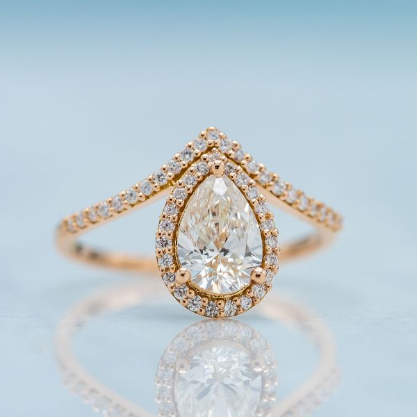 The rose gold setting's metal color masks any off color in this 1.01ct I color pear brilliant diamond.