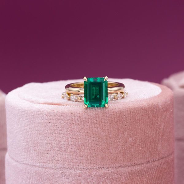 This beautiful emerald sits in a simple yellow gold setting.