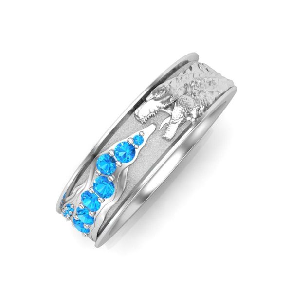 A fearsome Kaiju (Japanese giant monster) fires a cluster of Swiss blue topaz accents in this men’s engagement ring.