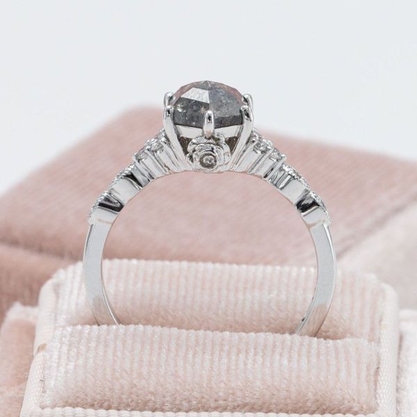 A hexagon cut salt and pepper diamond brought together the rose and vintage inspirations for this engagement ring.
