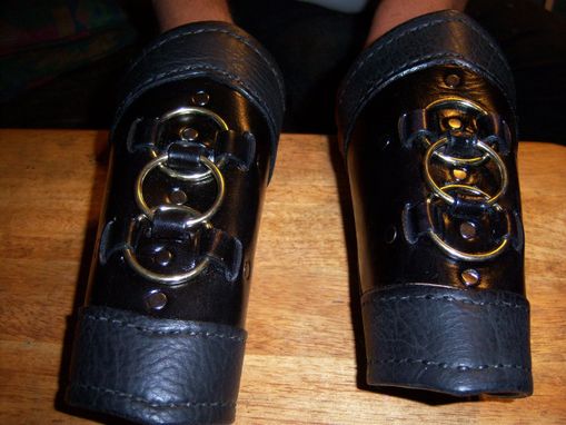 Custom Made Custom Black Three Brass Ring Bracers