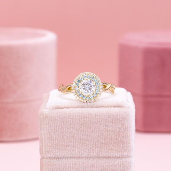 A unique double halo for this yellow gold engagement ring.